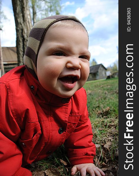 Little boy playing in leaves