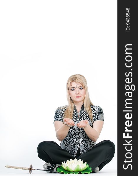 Woman Meditating In Lotus Pose