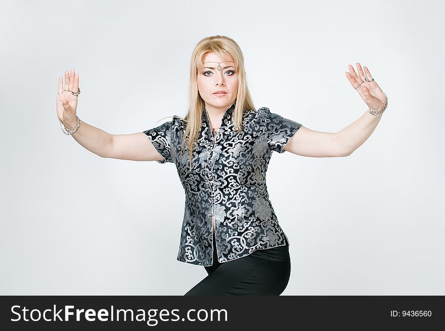 Beautiful woman exercising, studio shot