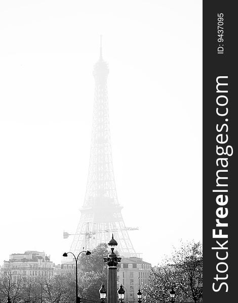 A shot of the Eiffel Tower in thick fog. A shot of the Eiffel Tower in thick fog