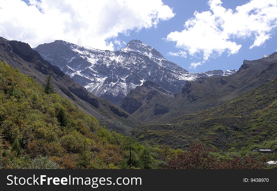 Sky and snow mountains in middle of China