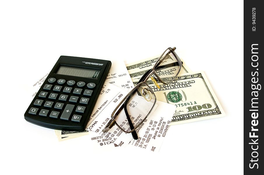 Calculator, checks and dollars on white background. Calculator, checks and dollars on white background