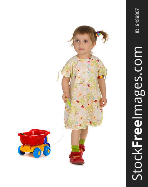 Little girl carries the toy car