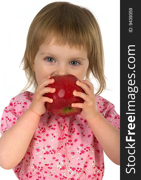 Little girl with red apple isolated on white background