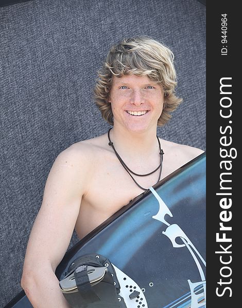 Young man stand with wakeboard. Young man stand with wakeboard
