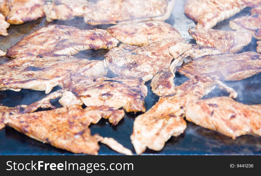 Fresh grilled meat on the barbecue.