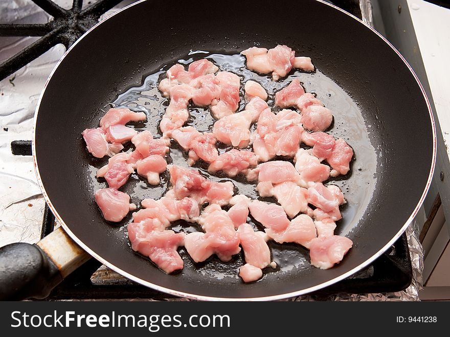 Raw sliced chicken on plate. Raw sliced chicken on plate