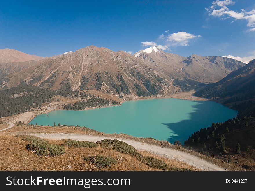 Big lake of the colour ultramarine in mountain terrain. Big lake of the colour ultramarine in mountain terrain