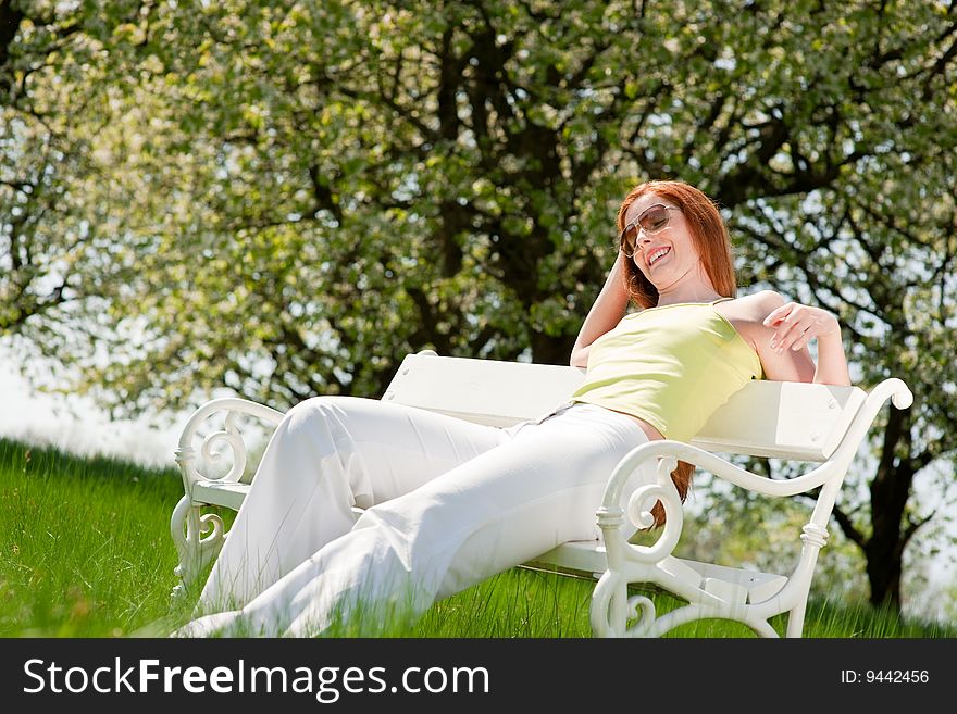 Woman Relax Under Blossom Tree In Summer