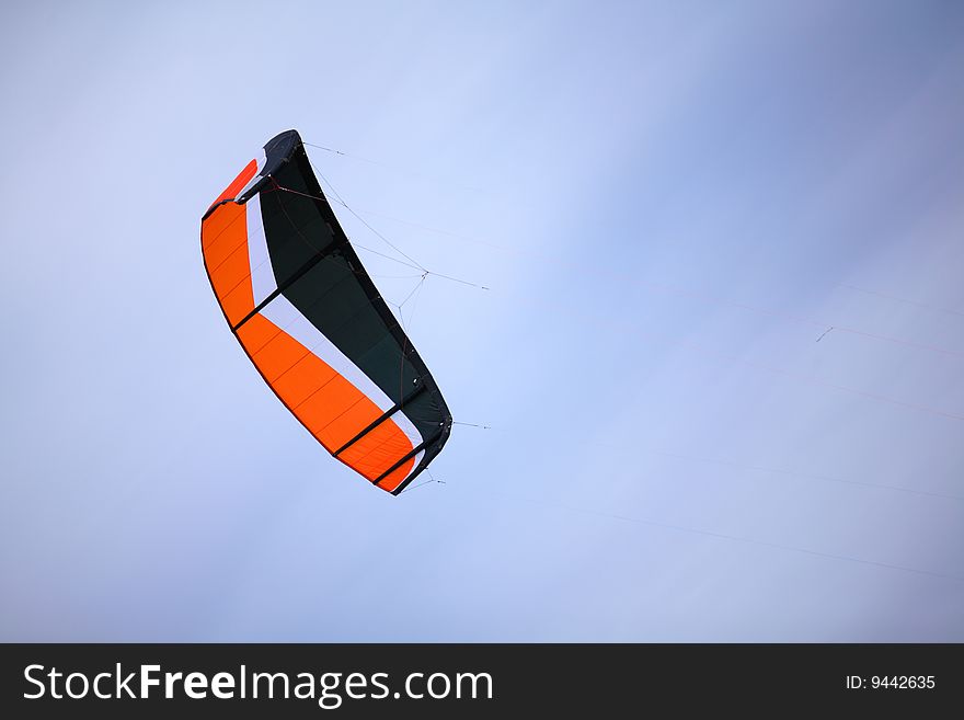 Multi-color parachute of surfing with cords under blue sky. Multi-color parachute of surfing with cords under blue sky