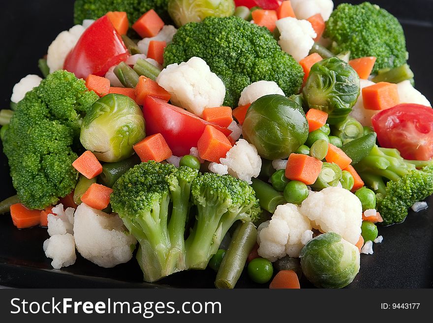 Vegetables: cauliflower, brussels sprouts, broccoli, carrots, string beans and tomatoes