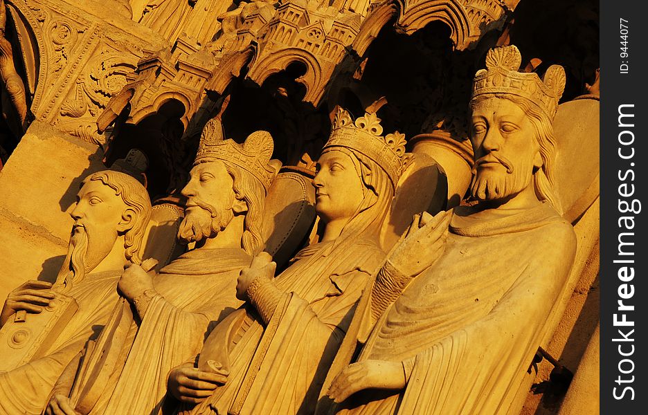 Saint statues with golden color, religional sculpture in the sunshine