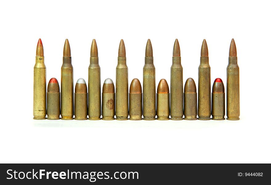 Row of alternating M16 assault rifle and 9mm Parabellum cartridges isolated. Row of alternating M16 assault rifle and 9mm Parabellum cartridges isolated