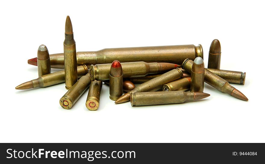 Pile of cartridges of various calibers isolated. Pile of cartridges of various calibers isolated