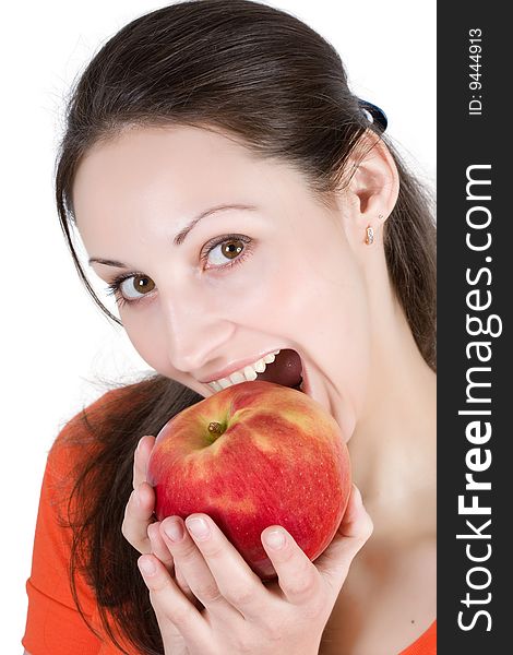 Woman eating apple on a white background