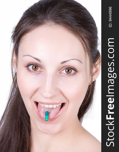 Woman taking pill on a white background