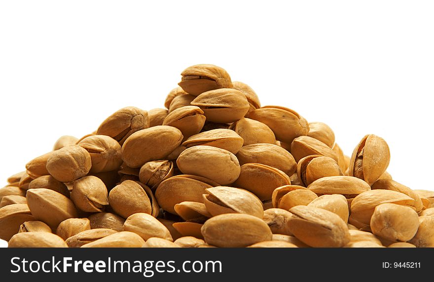 Pile of pistachios isolated on white background