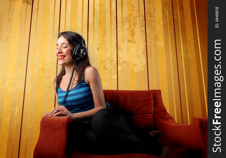 Beautiful girl listening music with headphones