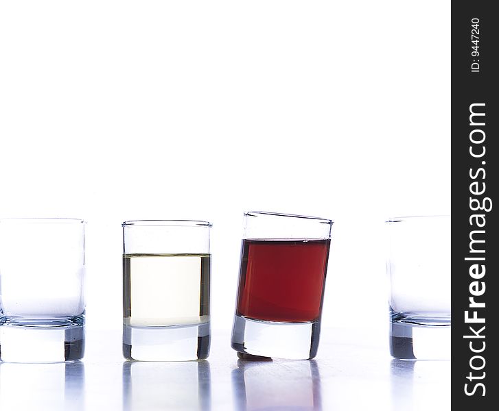 Closeup of glasses for alcoholic drinks. Isolated over white background