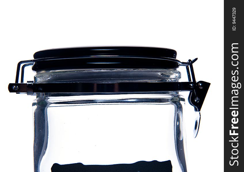 Close-up of transparent glass jar. Isolated over white