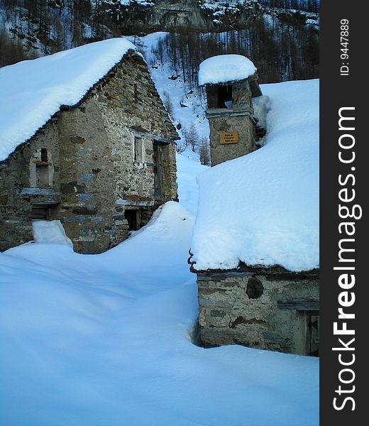 Two chalets under the snow. Two chalets under the snow