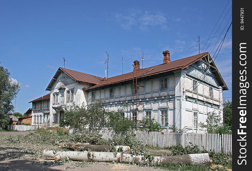 Old building and cutted tree