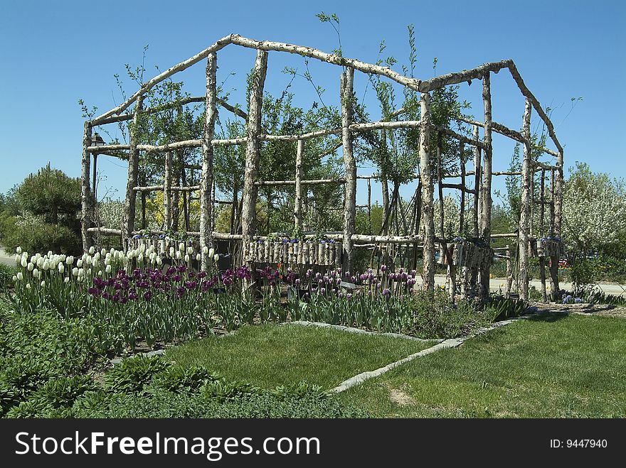 Log shaped open structure with flowers. Log shaped open structure with flowers