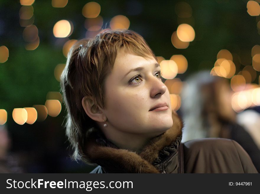 Night portrait of the woman on street