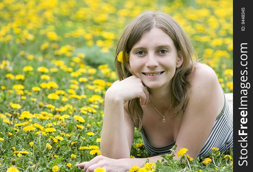 Blonde Girl Laying In A Meadow