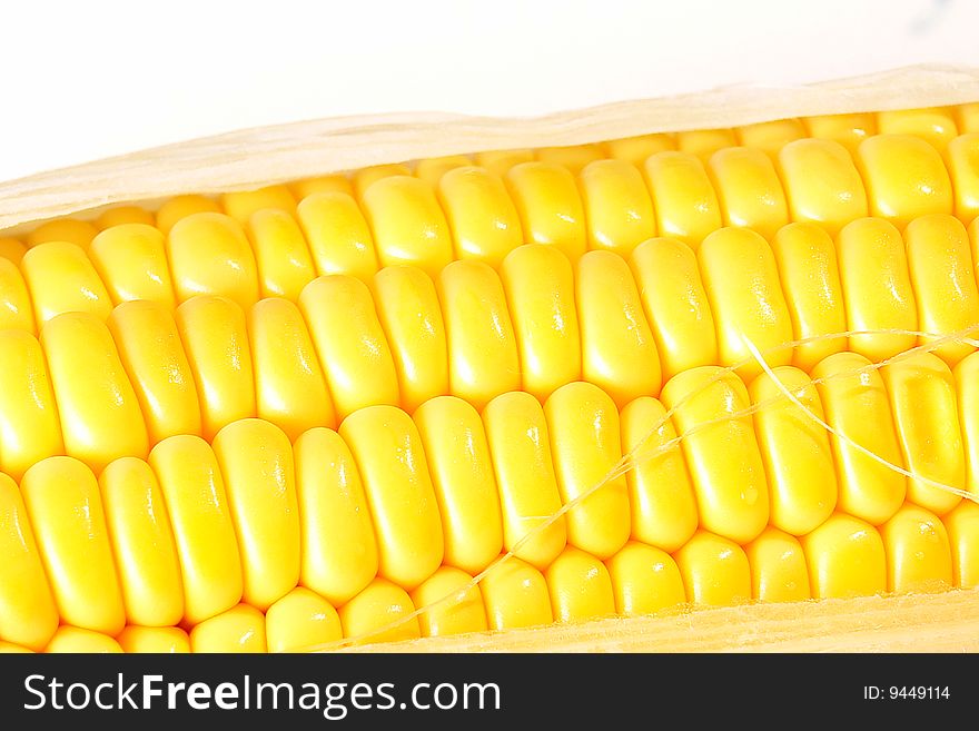 Yellow grains of corn on white background. Food image. Yellow grains of corn on white background. Food image