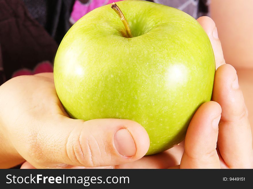 Green Apple on woman hand. Food image