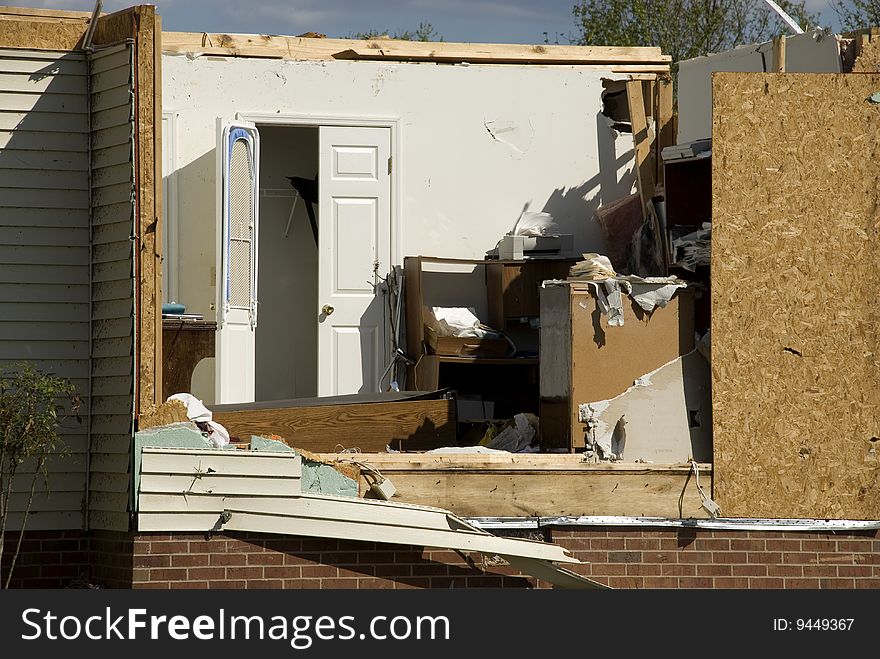 A house destroyed by an F4 tornado with only walls still standing, horizontal. A house destroyed by an F4 tornado with only walls still standing, horizontal