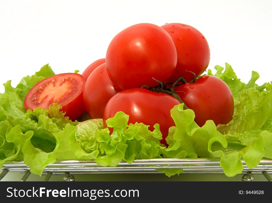 Ripe tomatoes, lettuce and glass of tomato juice