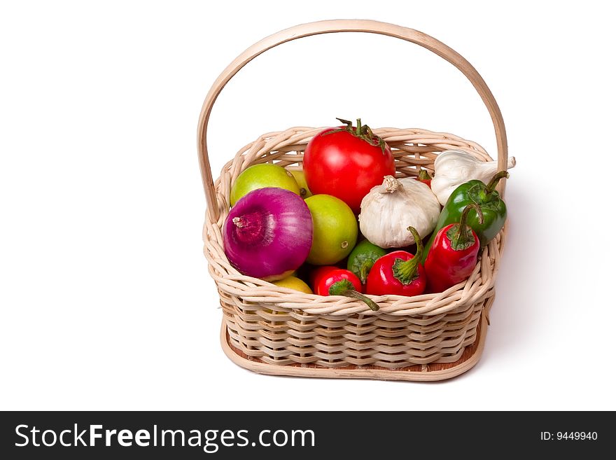 Bamboo basket having chili, lemon, garlic and onion. Bamboo basket having chili, lemon, garlic and onion