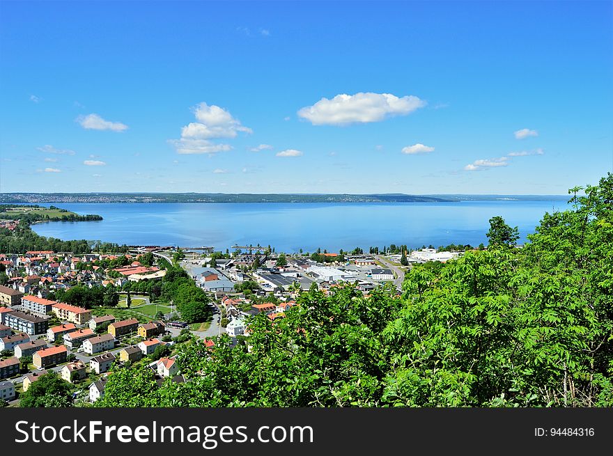 A view overlooking a tropical town and its bay. A view overlooking a tropical town and its bay.