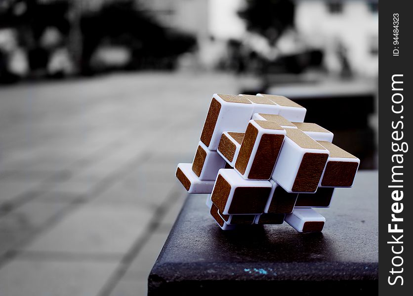 Closeup of a rubik's cube on a bench. Closeup of a rubik's cube on a bench.