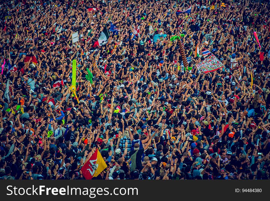 Aerial view of crowd celebrating at festival on sunny day. Aerial view of crowd celebrating at festival on sunny day.