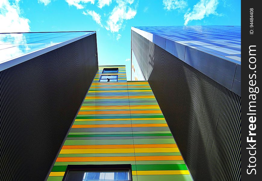 Angled view of a colourful skyscraper.