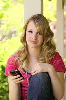 Attractive Teenager Sitting On Front Porch Stock Photo Attractive Teenager Sitting On Front Porch Stock Photo