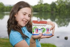 Girl With A Little House Stock Images