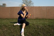 Girl Blowing Soap Bubbles Royalty Free Stock Photos