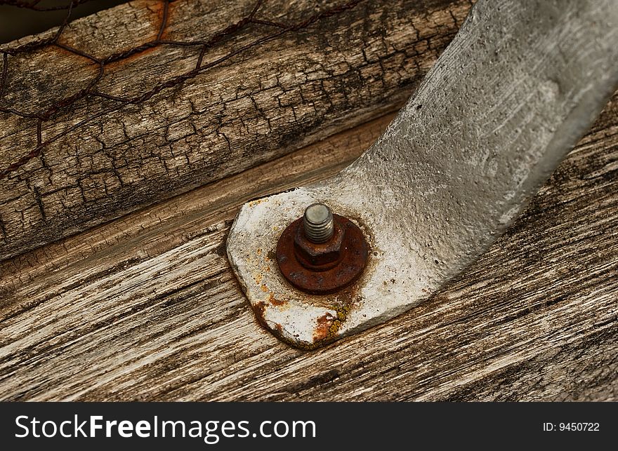 An old screw in wood.