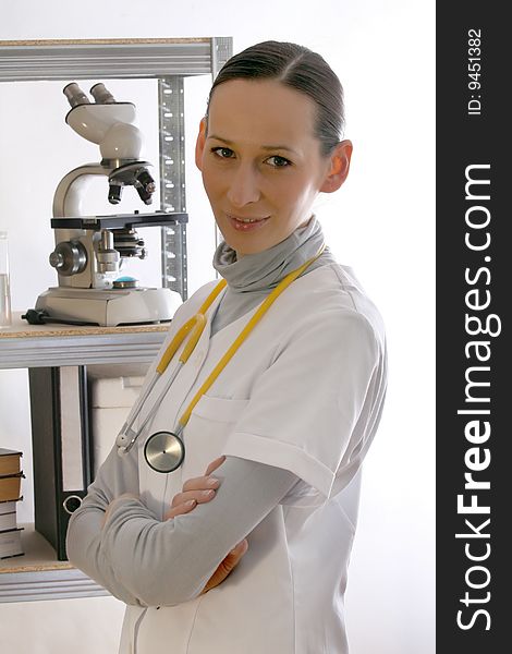 Female doctor with stethoscope posing indoor