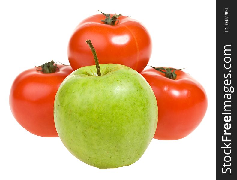 Green apple and red tomato isolated. Clipping path. Green apple and red tomato isolated. Clipping path