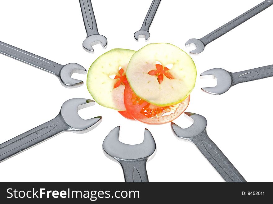 Cut apple, tomato and wrench isolated. Clipping path. Cut apple, tomato and wrench isolated. Clipping path