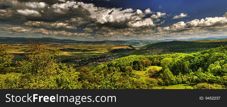 A view of the Carpathian mountains ahead from the top of a  hill. A view of the Carpathian mountains ahead from the top of a  hill.