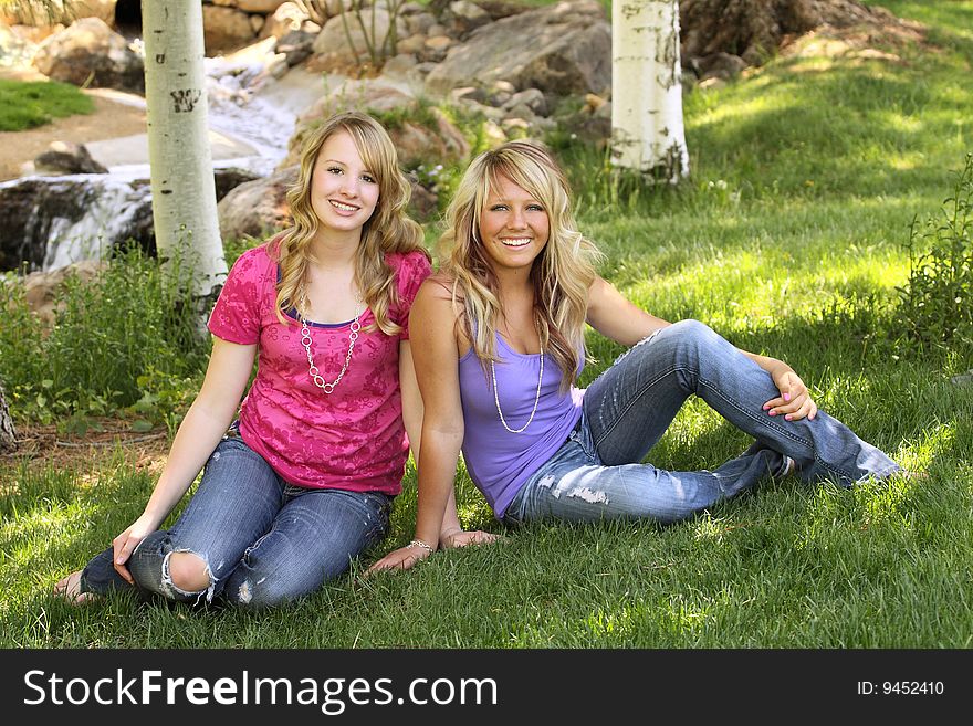 Two teenage girls posing for a portrait