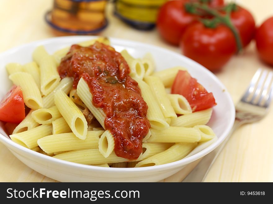 Fresh penne with tomato sauce.