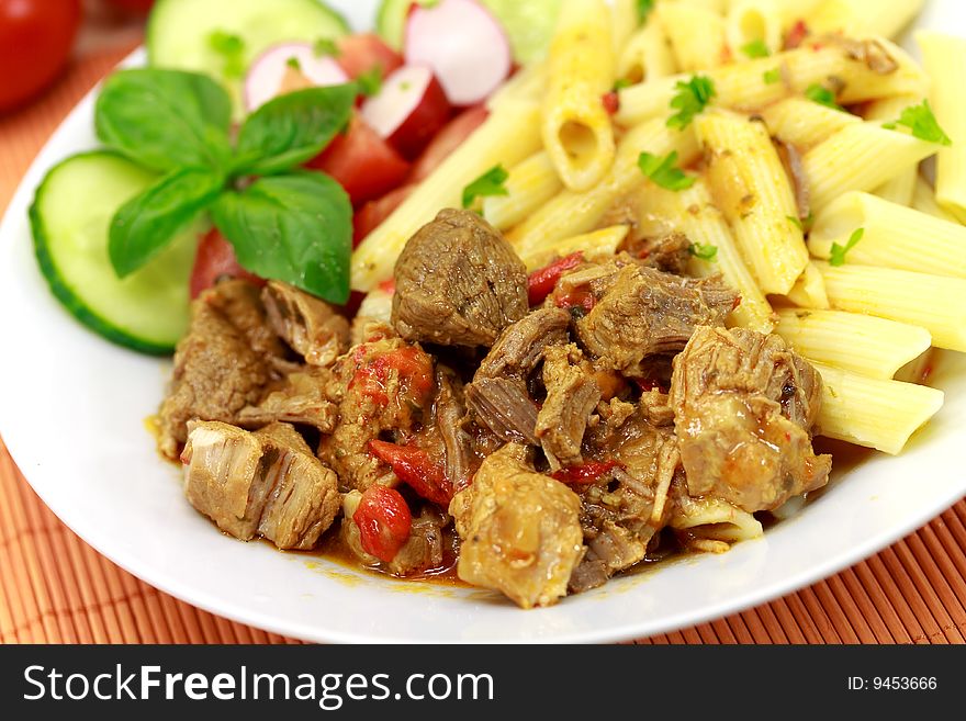 Goulash meat with penne noodles.