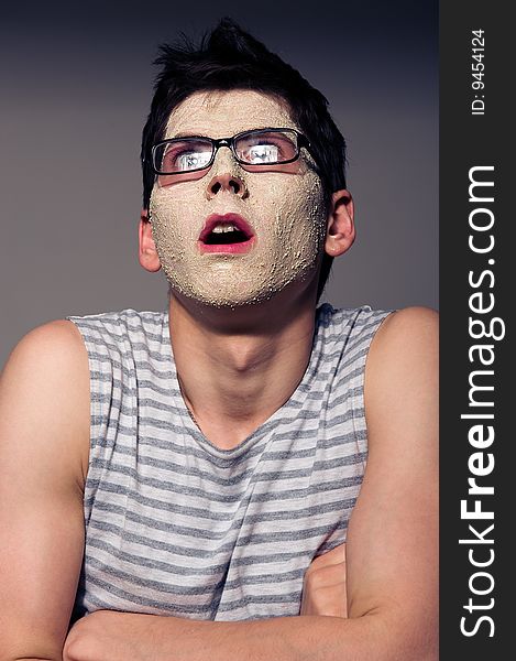 Funny man with facial mask and glasses